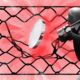 Bic Altcoins Negative Bat Baseball Player Break Through Net Fence.jpg.optimal.jpg