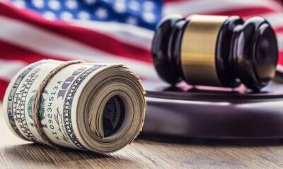 Us Flag With Judges Hammer And Dollar Bills.jpg