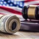 Us Flag With Judges Hammer And Dollar Bills.jpg