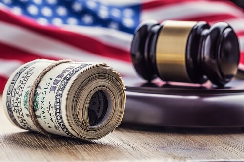 Us Flag With Judges Hammer And Dollar Bills.jpg