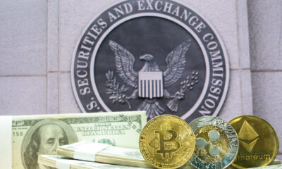 04 An Image Of Crypto Coins And Fiat Money In Front Of The Sec Logo.jpg